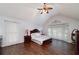 Spacious main bedroom features a vaulted ceiling, fan, and ample natural light at 489 Warrenton Dr, Douglasville, GA 30134