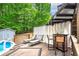 Outdoor living space with a deck, bar, lounge chairs, and a partial view of an in-ground pool at 489 Warrenton Dr, Douglasville, GA 30134