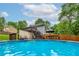 Relaxing pool view with lounge area and lush greenery, perfect for outdoor enjoyment at 489 Warrenton Dr, Douglasville, GA 30134