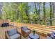 Spacious back deck with cozy seating area, ideal for enjoying the outdoors with wooded view at 1038 Huntcliff, Atlanta, GA 30350