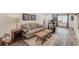 Finished basement area with neutral-toned decor, plush seating, and laminate flooring at 1038 Huntcliff, Atlanta, GA 30350