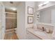 Updated bathroom featuring a granite countertop vanity, tiled shower, and wood flooring at 1038 Huntcliff, Atlanta, GA 30350