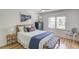 Cozy bedroom featuring hardwood floors, natural light, and stylish decor, creating a comfortable and inviting space at 1038 Huntcliff, Atlanta, GA 30350
