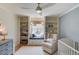 Cozy bedroom with a window seat, built-in shelving, and ample natural light at 1038 Huntcliff, Atlanta, GA 30350