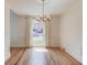 Bright dining room featuring hardwood floors, elegant trim, and a modern chandelier at 1038 Huntcliff, Atlanta, GA 30350