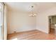 Elegant dining room featuring hardwood floors, decorative trim, and a modern chandelier at 1038 Huntcliff, Atlanta, GA 30350