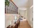 Welcoming entryway with hardwood floors, staircase, console table, and views into the living area at 1038 Huntcliff, Atlanta, GA 30350
