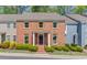 Charming brick townhome featuring a manicured front yard and classic architectural details at 1038 Huntcliff, Atlanta, GA 30350