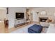 Bright living room with hardwood floors, fireplace, comfortable seating, and stylish furnishings at 1038 Huntcliff, Atlanta, GA 30350