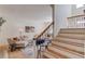 Elegant living room with wood floors, staircase, and comfortable seating area at 1038 Huntcliff, Atlanta, GA 30350