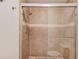 Shower with a glass door and tiled surround. Contains both standard and rainfall shower heads at 1038 Huntcliff, Atlanta, GA 30350