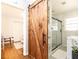 Stylish bathroom with a wood sliding door, shower, and sink at 1295 Lindenwood Ne Ln, Brookhaven, GA 30319