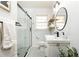 Modern bathroom featuring a glass-enclosed shower and vanity at 1295 Lindenwood Ne Ln, Brookhaven, GA 30319