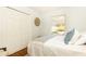 A cozy bedroom with white bedding, natural light, and closet at 1295 Lindenwood Ne Ln, Brookhaven, GA 30319