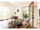 Dining area boasts natural light and access to a porch, creating a charming and inviting space at 1295 Lindenwood Ne Ln, Brookhaven, GA 30319