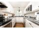Well-maintained kitchen features stainless steel appliances, streamlined cabinetry, and modern countertops at 1295 Lindenwood Ne Ln, Brookhaven, GA 30319