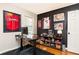 Office space featuring dark walls, sports memorabilia, and ample storage at 1295 Lindenwood Ne Ln, Brookhaven, GA 30319