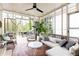 Comfortable screened porch with outdoor seating, a ceiling fan, and views of the backyard at 1295 Lindenwood Ne Ln, Brookhaven, GA 30319