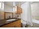 Bright bathroom featuring granite counters, modern fixtures, and a shower-tub combo at 145 15Th Ne St # 435, Atlanta, GA 30309