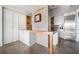 Spacious kitchen with stainless steel refrigerator, custom cabinetry, and stone flooring at 145 15Th Ne St # 435, Atlanta, GA 30309