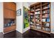 Library nook featuring built-in wooden bookshelves and a colorful painting at 145 15Th Ne St # 435, Atlanta, GA 30309