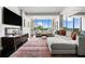 Bright living room with large windows, dark wood floors, contemporary decor, and open layout at 145 15Th Ne St # 435, Atlanta, GA 30309