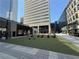 Inviting outdoor seating area with lawn and comfortable chairs, surrounded by commercial buildings at 145 15Th Ne St # 435, Atlanta, GA 30309