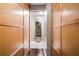 Hallway between the closet's cedar plank walls leads to a marble floored powder area at 145 15Th Ne St # 435, Atlanta, GA 30309