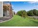 The expansive backyard includes lush green grass and a wood staircase to the upper level at 244 Walnut Ridge Rd, Canton, GA 30115