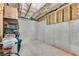 Unfinished basement space with concrete floor, block wall, and some storage at 244 Walnut Ridge Rd, Canton, GA 30115