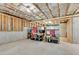 Unfinished basement with concrete floor, exposed beams, and storage shelves at 244 Walnut Ridge Rd, Canton, GA 30115