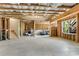 Unfinished basement with exposed beams, concrete floor, and staircase at 244 Walnut Ridge Rd, Canton, GA 30115