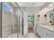 Ensuite bathroom boasts neutral paint, large vanity, and walk-in glass shower at 244 Walnut Ridge Rd, Canton, GA 30115