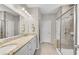 Bathroom features double vanity with granite counters and walk-in shower with glass door at 244 Walnut Ridge Rd, Canton, GA 30115