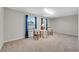 Spacious bedroom with natural light, two windows, and a small seating area at 244 Walnut Ridge Rd, Canton, GA 30115