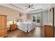 Bright bedroom with tray ceiling, hardwood floors, and large windows overlooking mature trees at 244 Walnut Ridge Rd, Canton, GA 30115