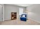Bedroom with a small seating area, a bookshelf, and neutral paint at 244 Walnut Ridge Rd, Canton, GA 30115