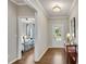 Bright foyer featuring hardwood floors, elegant console table, and view into the bedroom at 244 Walnut Ridge Rd, Canton, GA 30115