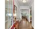 Bright foyer featuring hardwood floors, elegant console table, and view into the spacious living areas at 244 Walnut Ridge Rd, Canton, GA 30115