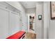 Hallway with bench seating, hooks and storage, leading to a laundry room at 244 Walnut Ridge Rd, Canton, GA 30115