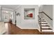 Hallway features hardwood floors, staircase, and decor shelving at 244 Walnut Ridge Rd, Canton, GA 30115
