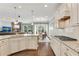Open kitchen features stainless steel appliances, granite countertops, and an island with a sink at 244 Walnut Ridge Rd, Canton, GA 30115