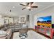 Open living room with hardwood floors, a ceiling fan and views of the kitchen and staircase at 244 Walnut Ridge Rd, Canton, GA 30115