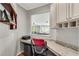 Functional office nook features a granite countertop, modern cabinetry and view into the adjacent living area at 244 Walnut Ridge Rd, Canton, GA 30115
