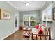 Bright and airy sunroom offers a sitting area and access to an outdoor space at 244 Walnut Ridge Rd, Canton, GA 30115