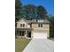 Charming two-story home with a well-manicured lawn, inviting curb appeal, and a convenient two-car garage at 2706 Sw Riverpine Lot 176 Sw Trl, Atlanta, GA 30331