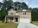 Charming two-story home with a two car garage and a well-manicured lawn at 2706 Sw Riverpine Lot 176 Sw Trl, Atlanta, GA 30331