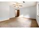 Bedroom with ceiling fan, carpeted floor and large window at 285 Independence Dr, Jonesboro, GA 30238