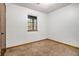 Bedroom with one window, carpeted floor and view to exterior at 285 Independence Dr, Jonesboro, GA 30238