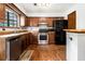 Updated kitchen with wood cabinets, stainless steel appliances, and plenty of counter space at 285 Independence Dr, Jonesboro, GA 30238